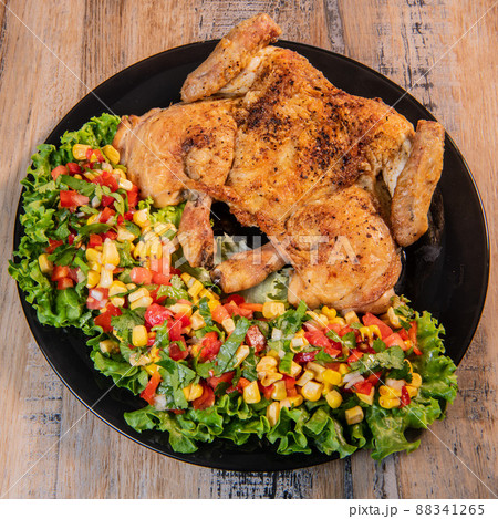 Chicken recipe, roast cockerel and its vegetables, corn condiment 88341265