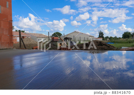 Masonry, Man leveling concrete slab for house terrace Masonry, Man leveling concrete slab for house terrace 88341670