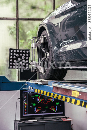 fixing your car at the garage by a mechanic 88342135