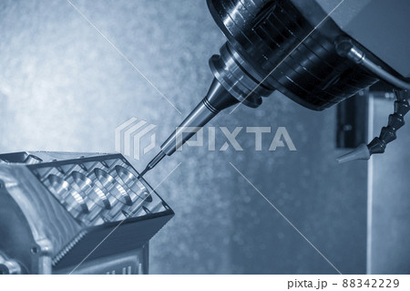 The 5-axis machining center cutting the aluminum V8 engine block parts with solid ball endmill tool. The 5-axis machining center cutting the aluminum V8 engine block parts with solid ball endmill tool. 88342229