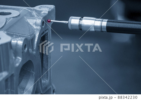 The multi-axis CMM machine measuring the cylinder head parts . 88342230