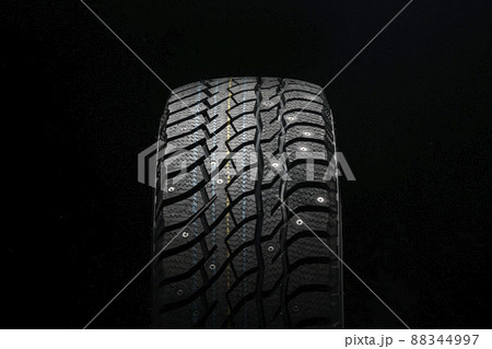 new winter studded tire on a black background new winter studded tire on a black background 88344997