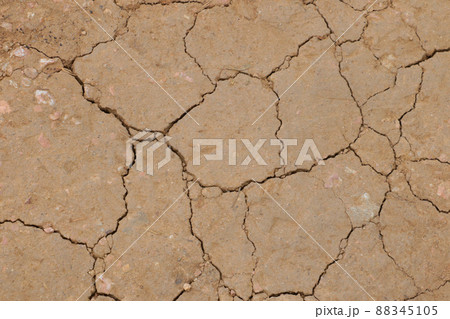 The texture of the cracked earth, the view from above, the background. Dry earth. The texture of the cracked earth, the view from above, the background. Dry earth. 88345105