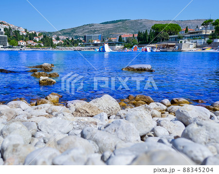 Blue clear beach on the shore of the city of Dubrovnik Blue clear beach on the shore of the city of Dubrovnik 88345204