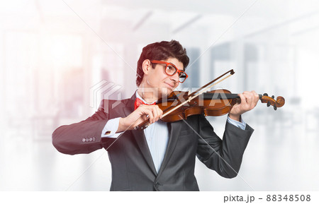 young musician plays the violin 88348508