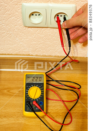 Metering socket voltage with modern digital multimeter. Metering socket voltage with modern digital multimeter. 88349376