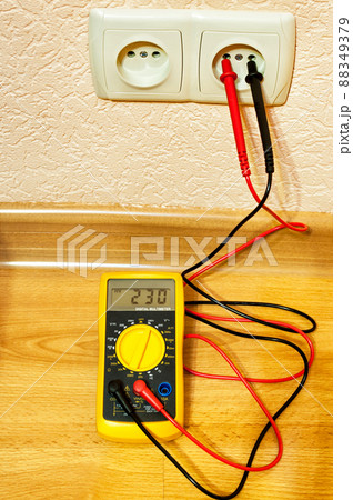 Metering socket voltage with modern digital multimeter. Metering socket voltage with modern digital multimeter. 88349379