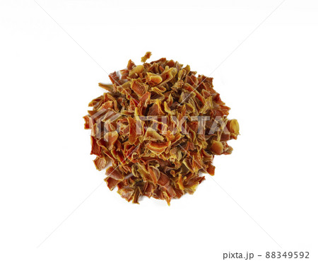 dried carrot pieces heap isolated on white background. Spices and food ingredients. 88349592