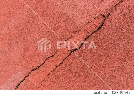 Old crack broken red concrete wall damage background cement cracked texture Old crack broken red concrete wall damage background cement cracked texture 88349647