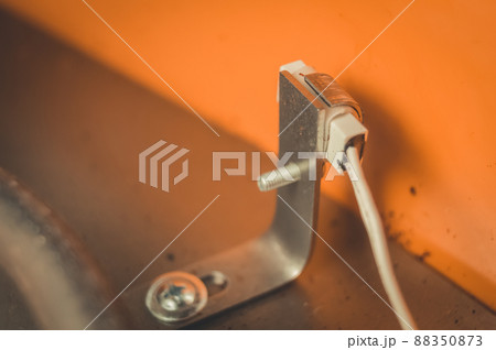 Temperature sensor inside an electric dryer for vegetables and fruits. Repair of household appliances. Selective focus 88350873