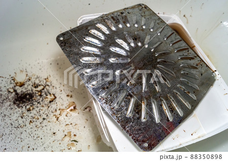 Dirty trays and electric dryer panels for food dehydration. Washing dirty home equipment. Selective focus 88350898