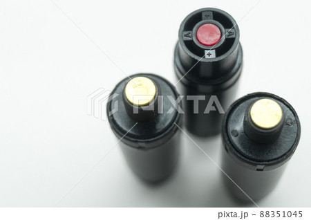 Aerosol pepper cartridges for a protective gun. Means of self-defense against attacks by aggressive people and animals. Selective focus, isolated on white, copy space Aerosol pepper cartridges for a protective gun. Means of self-defense against attacks by aggressive people and animals. Selective focus, isolated on white, copy space 88351045