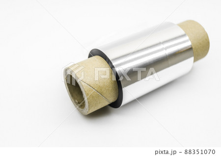 Single thermal transfer ribbon - TTR. Wax thermo ribbon on cardboard reel for barcode. Supply material for printing industry. Selective focus, isolated on white Single thermal transfer ribbon - TTR. Wax thermo ribbon on cardboard reel for barcode. Supply material for printing industry. Selective focus, isolated on white 88351070