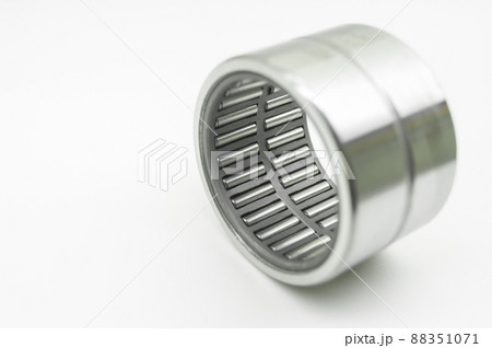 Needle bearing on a white background. Roller bearing for motors, machinery and equipment. Spare part. Selective focus, isolated on white 88351071