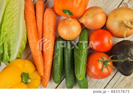 Fresh Summer Vegetables on a Rustic Wooden Table, overhead flat lay view 88357675