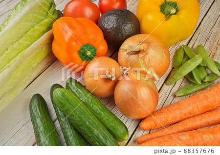 High Angle View of Selection of Fresh Summer Vegetables on a Rustic Wooden Table 88357676