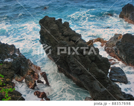 High Angle View of Lava Cliffs at Waianapanapa State Park in Hana, Hawaii on the island of Maui 88357698