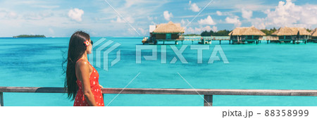 luxury resort honeymoon vacation cruise destination in Bora Bora island, Tahiti, French Polynesia. Woman walking on idyllic beach landscape header banner luxury resort honeymoon vacation cruise destination in Bora Bora island, Tahiti, French Polynesia. Woman walking on idyllic beach landscape header banner 88358999