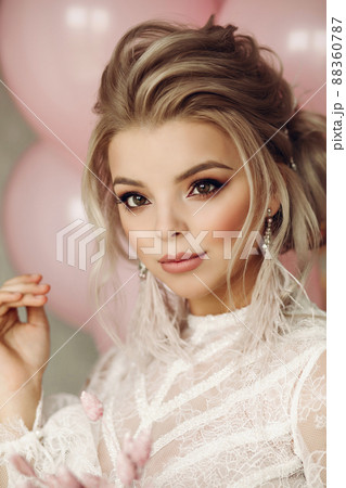 Gorgeous blonde girl with pink air balloons. Gorgeous blonde girl with pink air balloons. 88360787