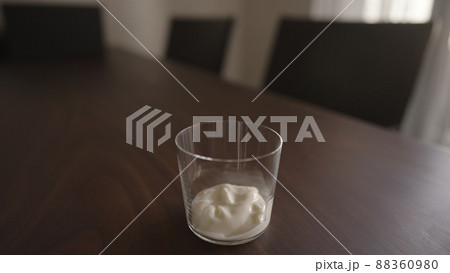 add yogut in tumbler glass on wood table add yogut in tumbler glass on wood table 88360980