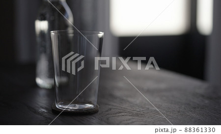 tonic water with tumbler glass on wood table 88361330