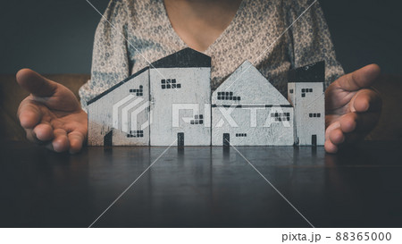 Housing Loan and Real Estate Broker Selling Agency Concept. Business Woman Hands Offer House Model to Customer for Sale,Rent. Business House Realty Agent and Residential Investment. 88365000