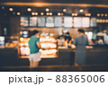 Blur Coffee Cafe Shop and Bokeh Light Bulb Background. Defocused Image and Blur Customer People in Coffee Counter Shop. Blur Cafe Store Shop Lifestyles and Client Service Food Event 88365006