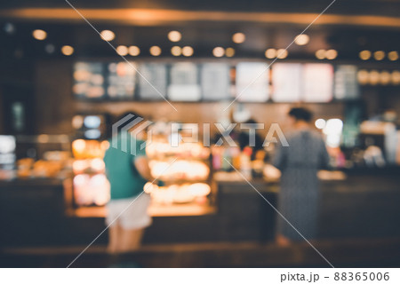 Blur Coffee Cafe Shop and Bokeh Light Bulb Background. Defocused Image and Blur Customer People in Coffee Counter Shop. Blur Cafe Store Shop Lifestyles and Client Service Food Event Blur Coffee Cafe Shop and Bokeh Light Bulb Background. Defocused Image and Blur Customer People in Coffee Counter Shop. Blur Cafe Store Shop Lifestyles and Client Service Food Event 88365006