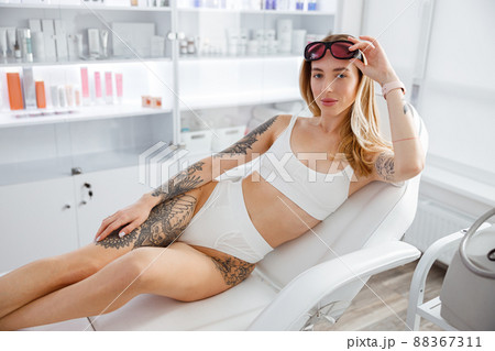 Young woman in lingerie resting in beauty salon Young woman in lingerie resting in beauty salon 88367311