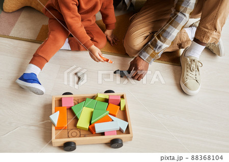 Father and Son Playing with Wooden Toys Father and Son Playing with Wooden Toys 88368104