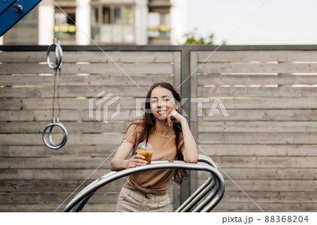 woman with fresh fruit juice cup woman with fresh fruit juice cup 88368204