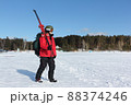 Man with a mountain  skis going to training  88374246