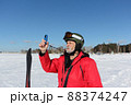 Man  measures wind speed with an anemometer 88374247