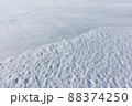 Relief snow surface of a frozen river in  winter 88374250
