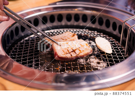 Grilling meat pork Korean BBQ traditional style on stove serve in restaurant 88374551