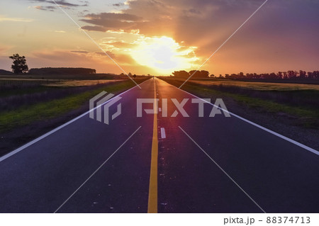 Landscape with road and stormy sky at sunset 88374713