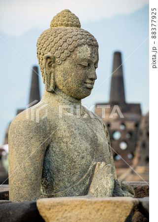 Side portrait of buddha statue at buddhist temple Borobudur, Java, Indonesia Side portrait of buddha statue at buddhist temple Borobudur, Java, Indonesia 88377925