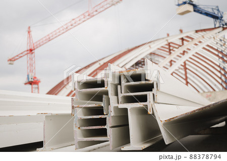 I-beam steel painted white lay piles on concrete, Raw materials used in building construction. Steel structure construction, Photo of I-beam used in steel frame construction. I-beam steel. I-beam steel painted white lay piles on concrete, Raw materials used in building construction. Steel structure construction, Photo of I-beam used in steel frame construction. I-beam steel. 88378794