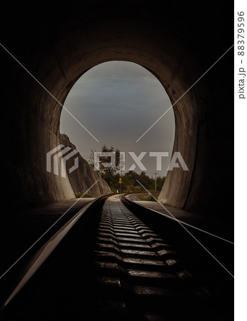 Inside the railroad tunnel and railways with natural light at the end. Light at the end of the tunnel, Lights and shadows, Concept of achieving your goals, Inside the railroad tunnel and railways with natural light at the end. Light at the end of the tunnel, Lights and shadows, Concept of achieving your goals, 88379596