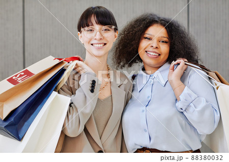 Two Young Girls Enjoying Shopping 88380032
