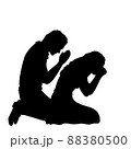 Silhouettes of man and woman pray. 88380500
