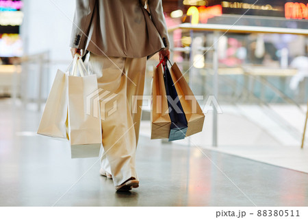 Girl with Shopping Bags in Mall Minimal 88380511