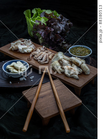 Fresh grilled squid, Octopus tentacles and Squids eggs on Wooden tray. Fresh grilled squid, Octopus tentacles and Squids eggs on Wooden tray. 88380513
