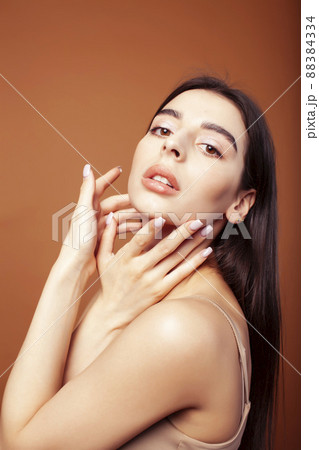 cute happy young indian woman in studio closeup smiling on brown background, fashion beauty lifestyle people concept cute happy young indian woman in studio closeup smiling on brown background, fashion beauty lifestyle people concept 88384334