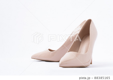 Elegant beige women's shoes with high heels. White background. Patent leather. Side view Elegant beige women's shoes with high heels. White background. Patent leather. Side view 88385165