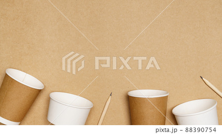 Eco friendly concept, Consist of paper cup and pencil with cotton buds on wooden background 88390754