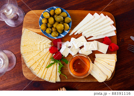 Cheese plate with raspberry and olives Cheese plate with raspberry and olives 88391116