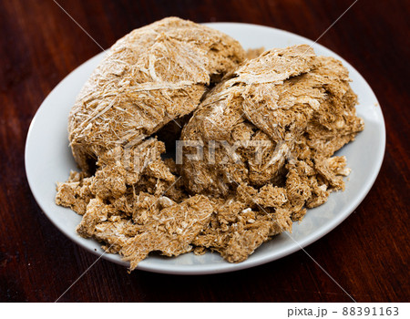 Traditional russian dessert halva from sunflower at plate Traditional russian dessert halva from sunflower at plate 88391163