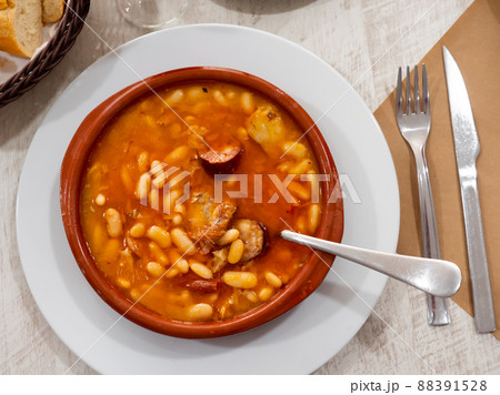 Fabada asturiana in brown soup plate 88391528