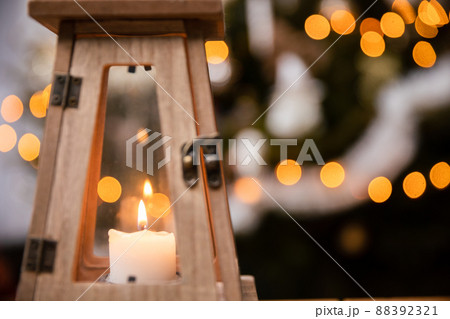 A candle burns closed inside a decorative lantern on Christmas Day. A candle burns closed inside a decorative lantern on Christmas Day. 88392321